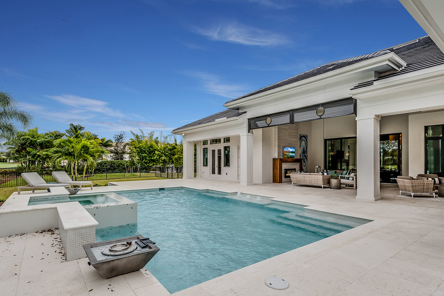 Luxurious swimming pool and entertaining area on a bright sunny day
